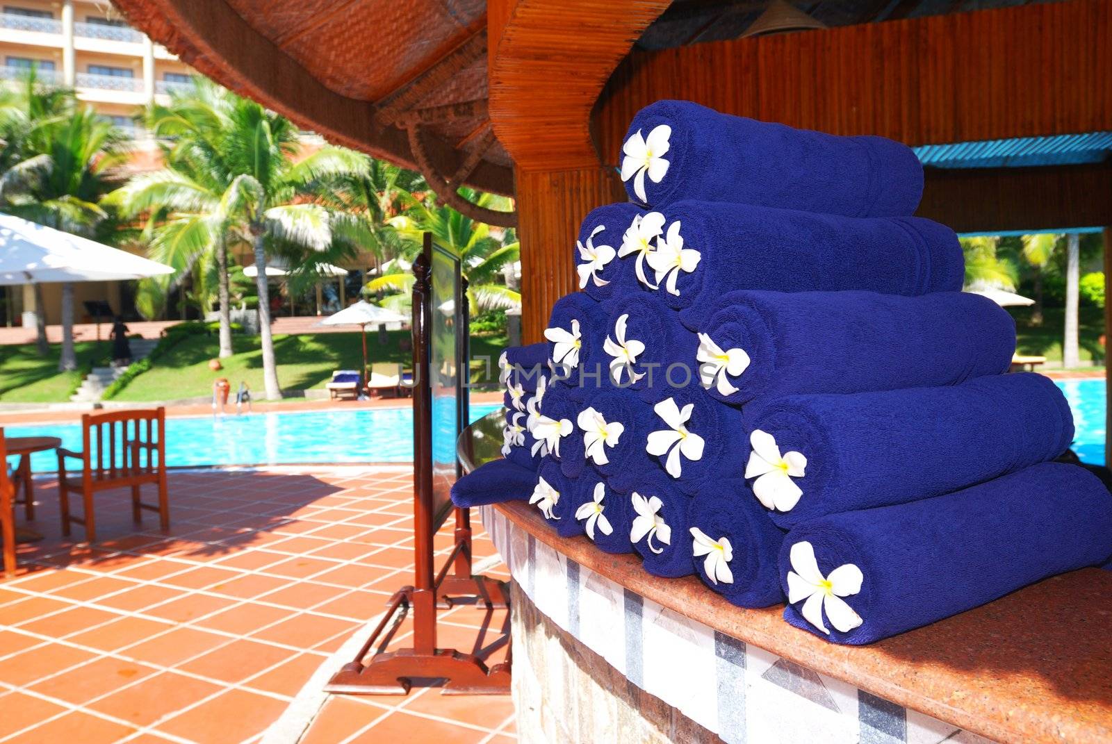 Blue towels near the swimming pool