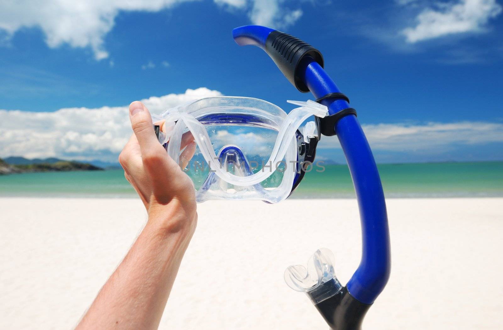 Snorkel equipment against beach and sky