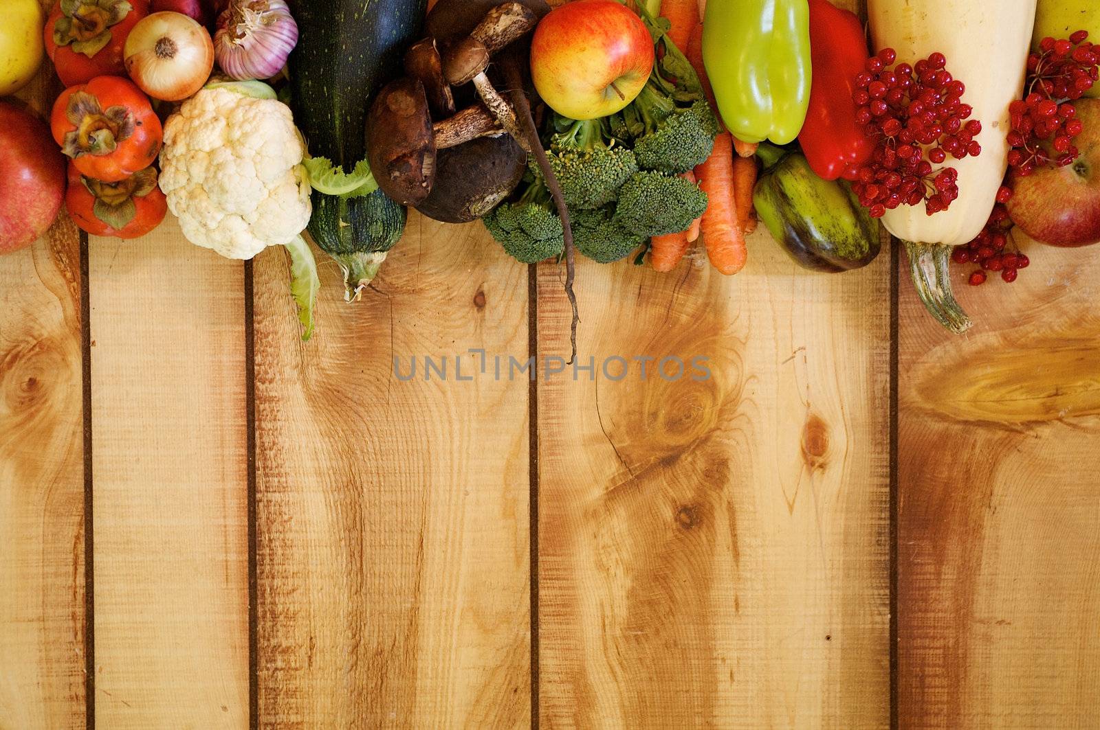 Frame New Harvest Autumn Yield with Vegetables, Fruits, Mushrooms and Berries closeup on Wooden background