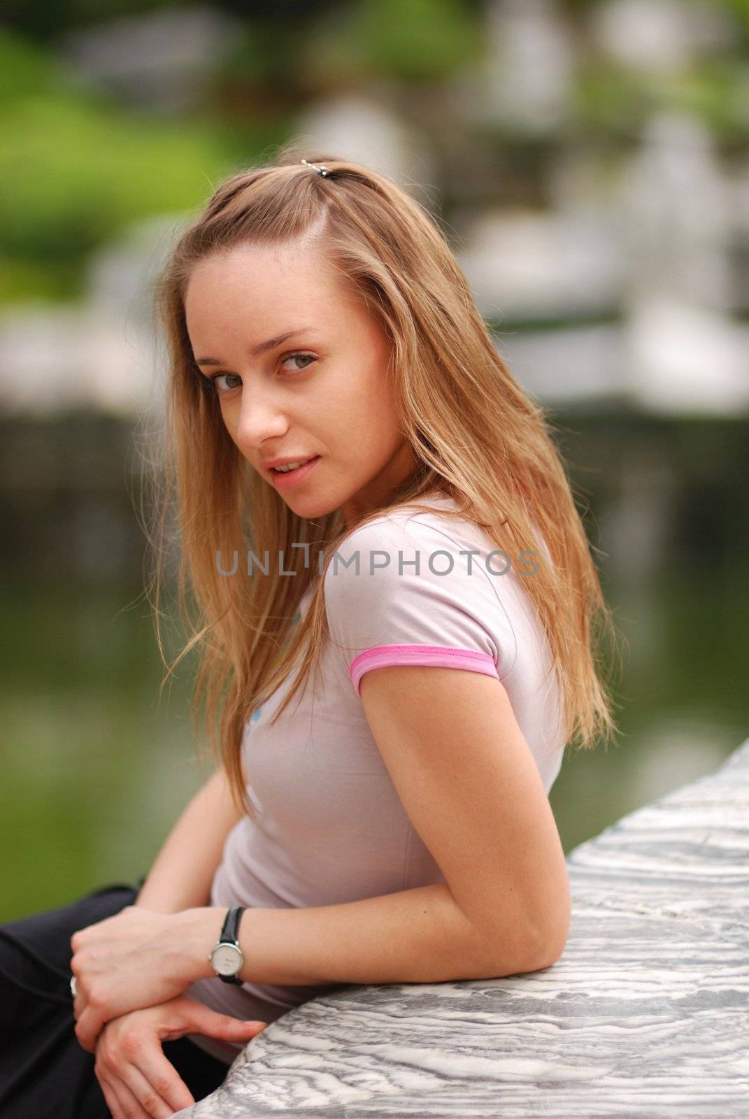 Girl on a stone, shallow depth of field