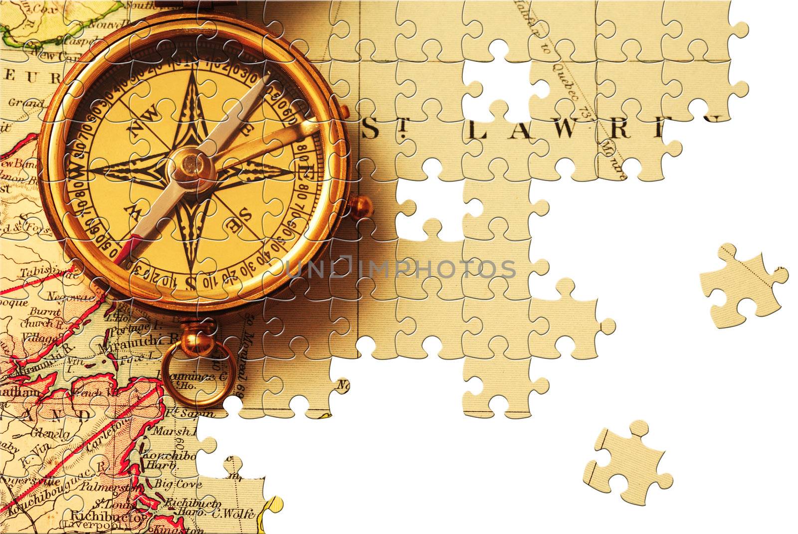Puzzle Antique brass compass over old Canadian map background
