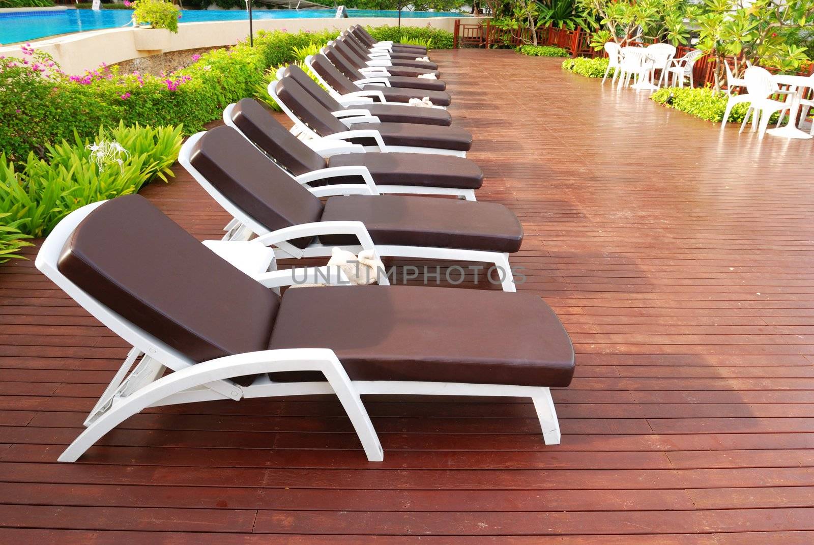 Patio with chaise lounges near luxury hotel