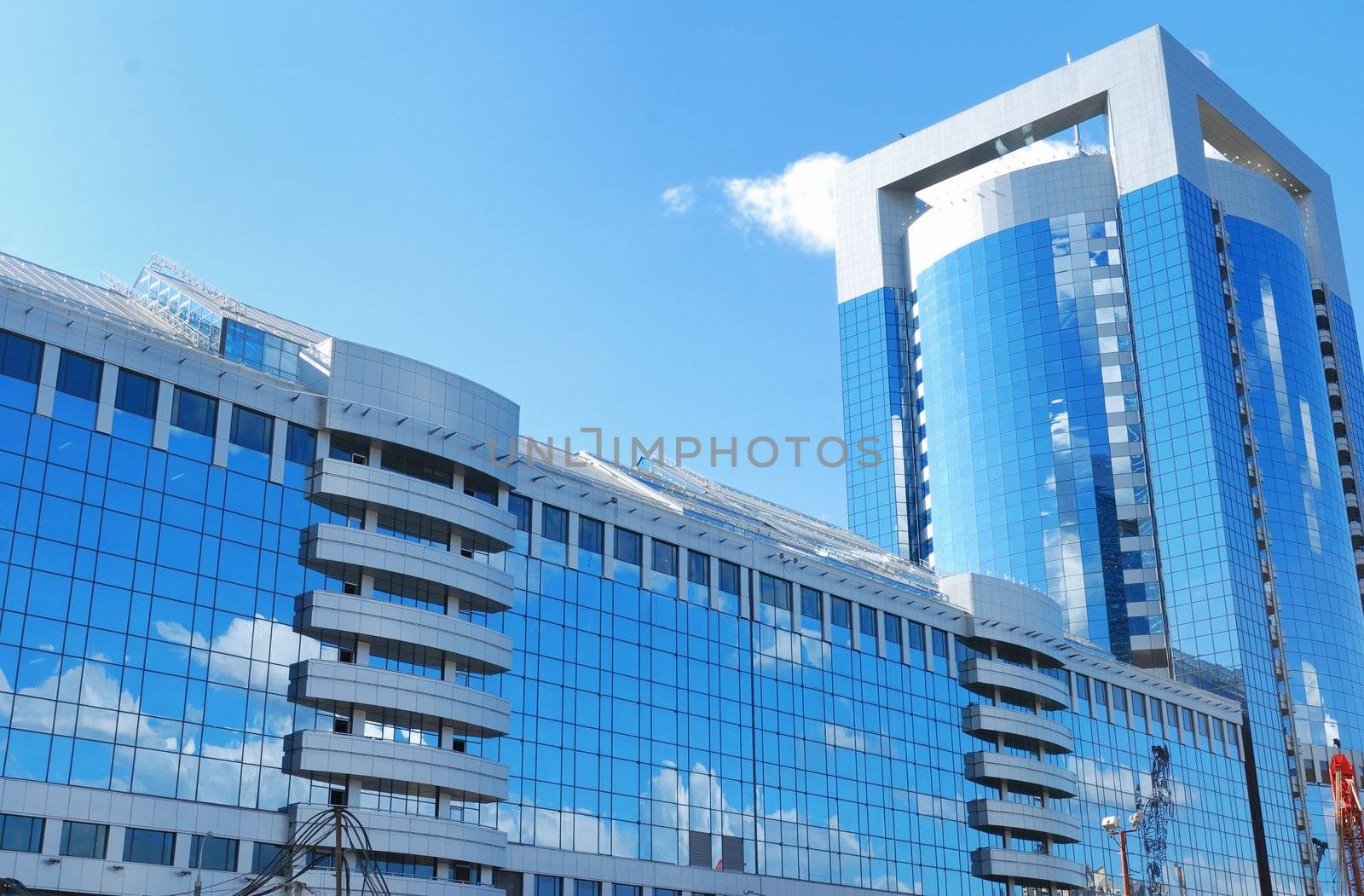 Modern office building with sky reflection in windows