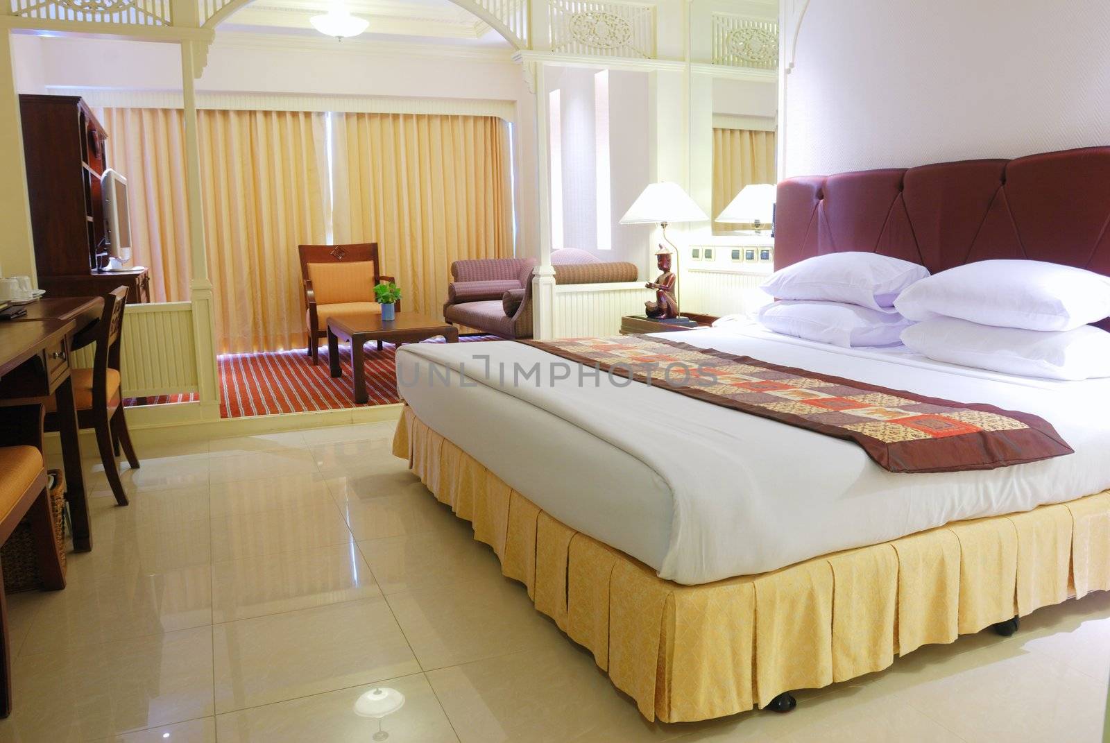 Luxurious hotel room interior with king-size bed