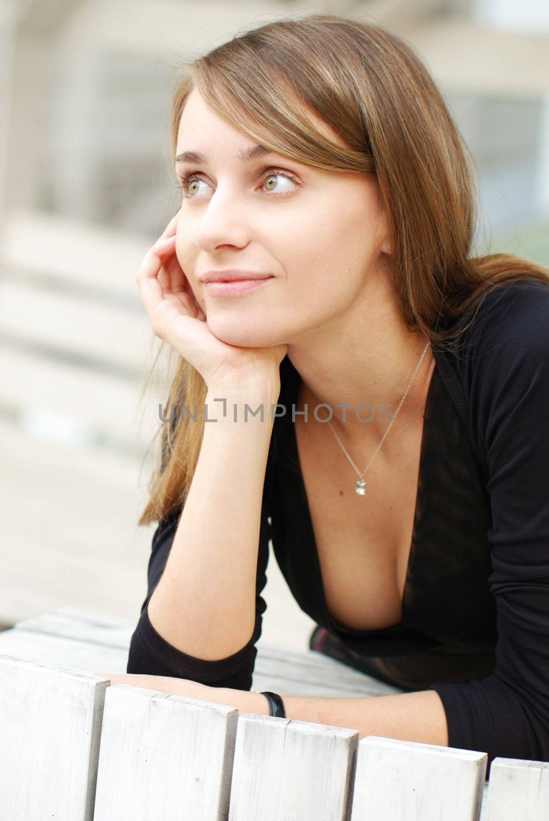 Young thoughtful girl outdoor portrait