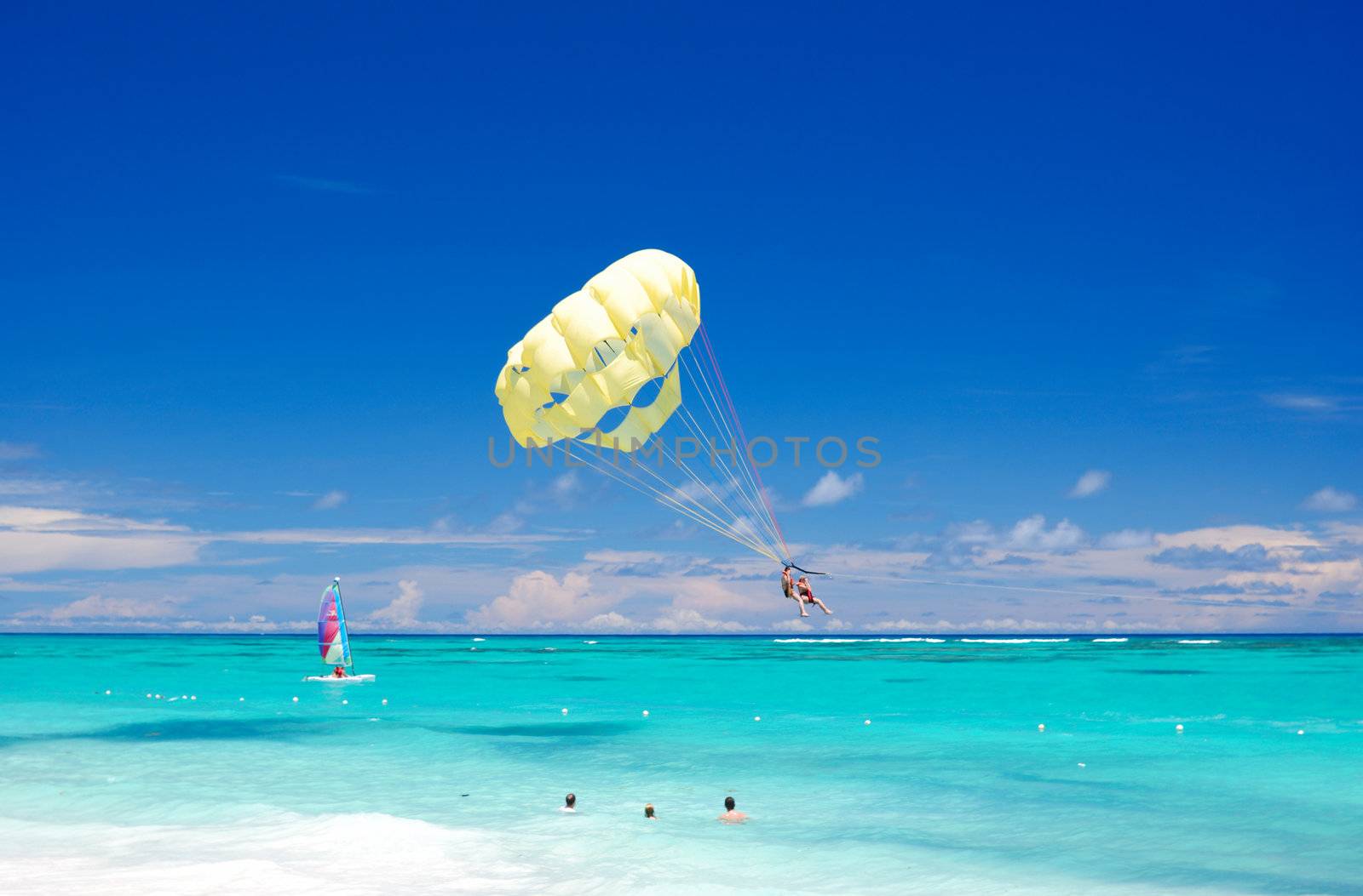 Beautiful caribbean beach in Dominican Republic. Unrecognizable people.