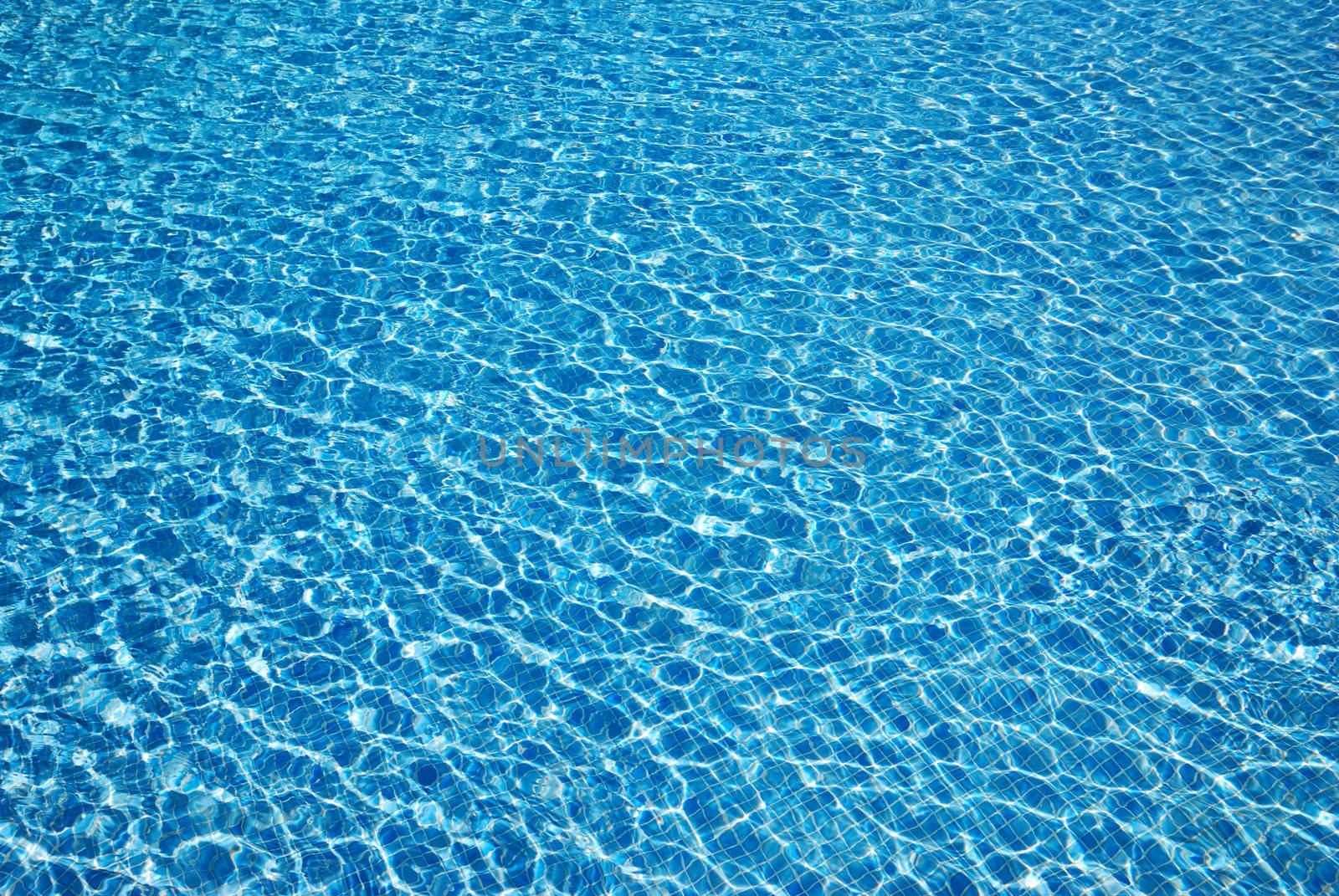 Water background. Swimming pool in the tropical hotel.