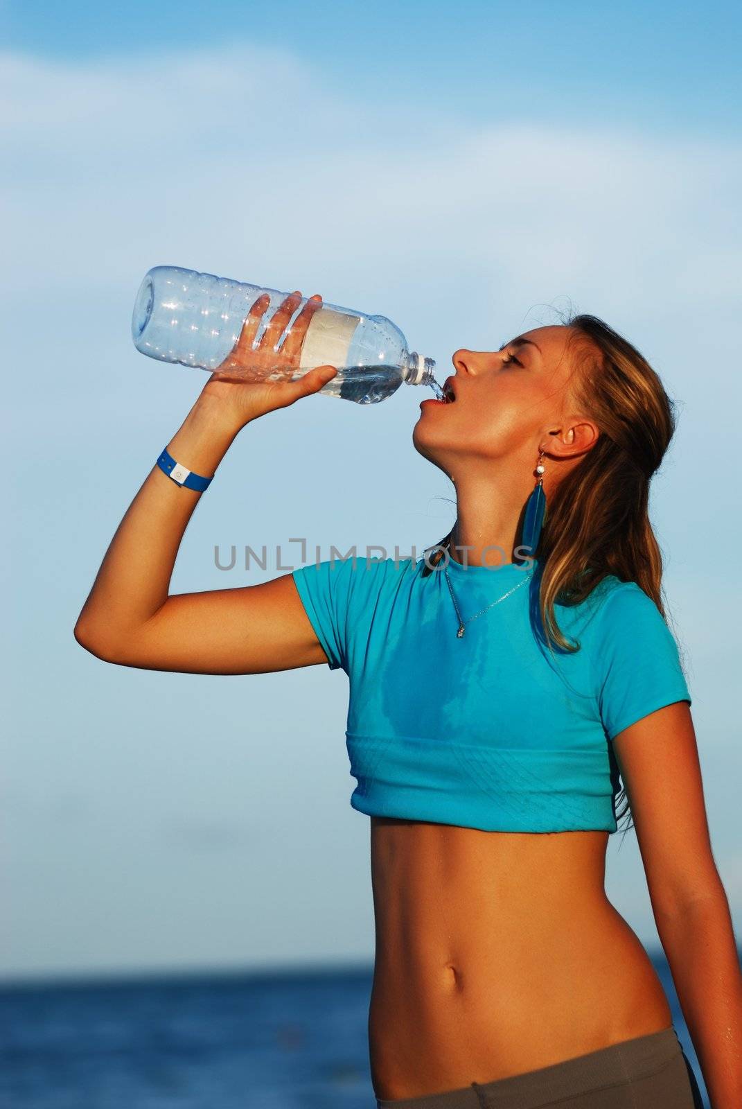Woman drinking water by haveseen