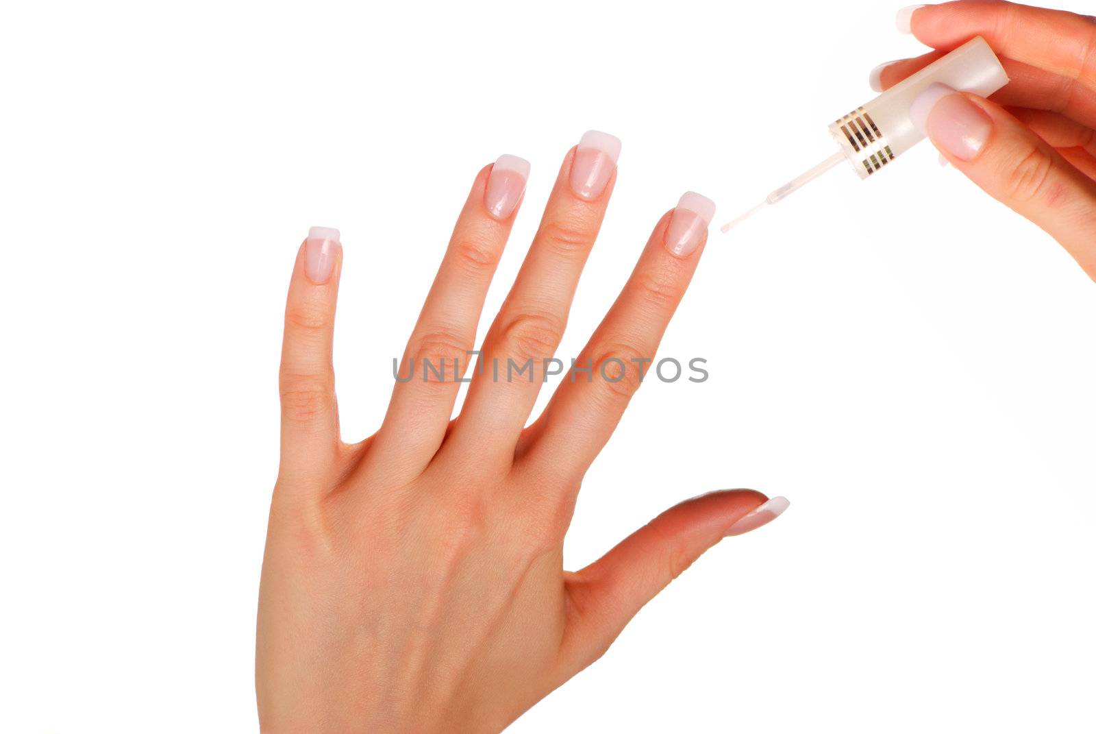 Woman applying white nail polish