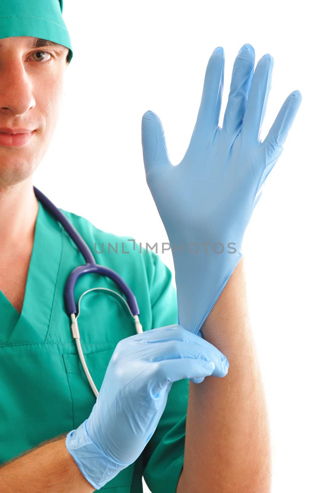 Doctor pulling on surgical glove