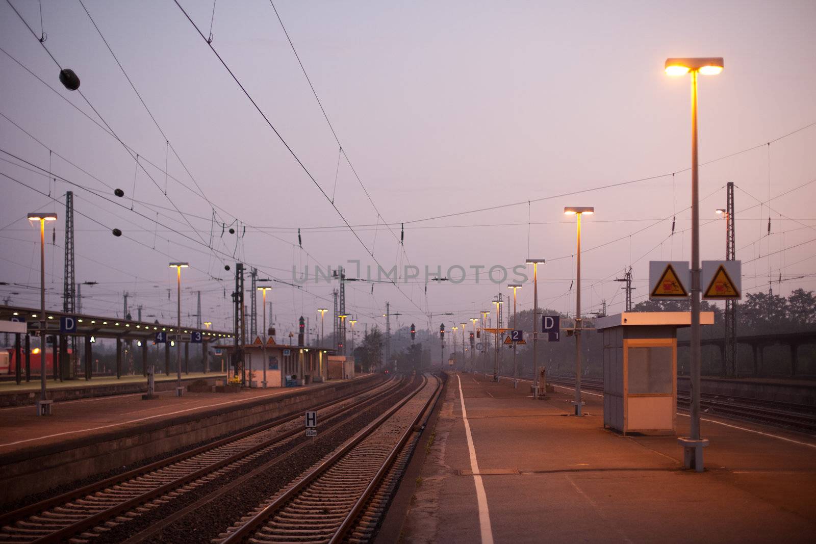 Platform of a German train station at dawn