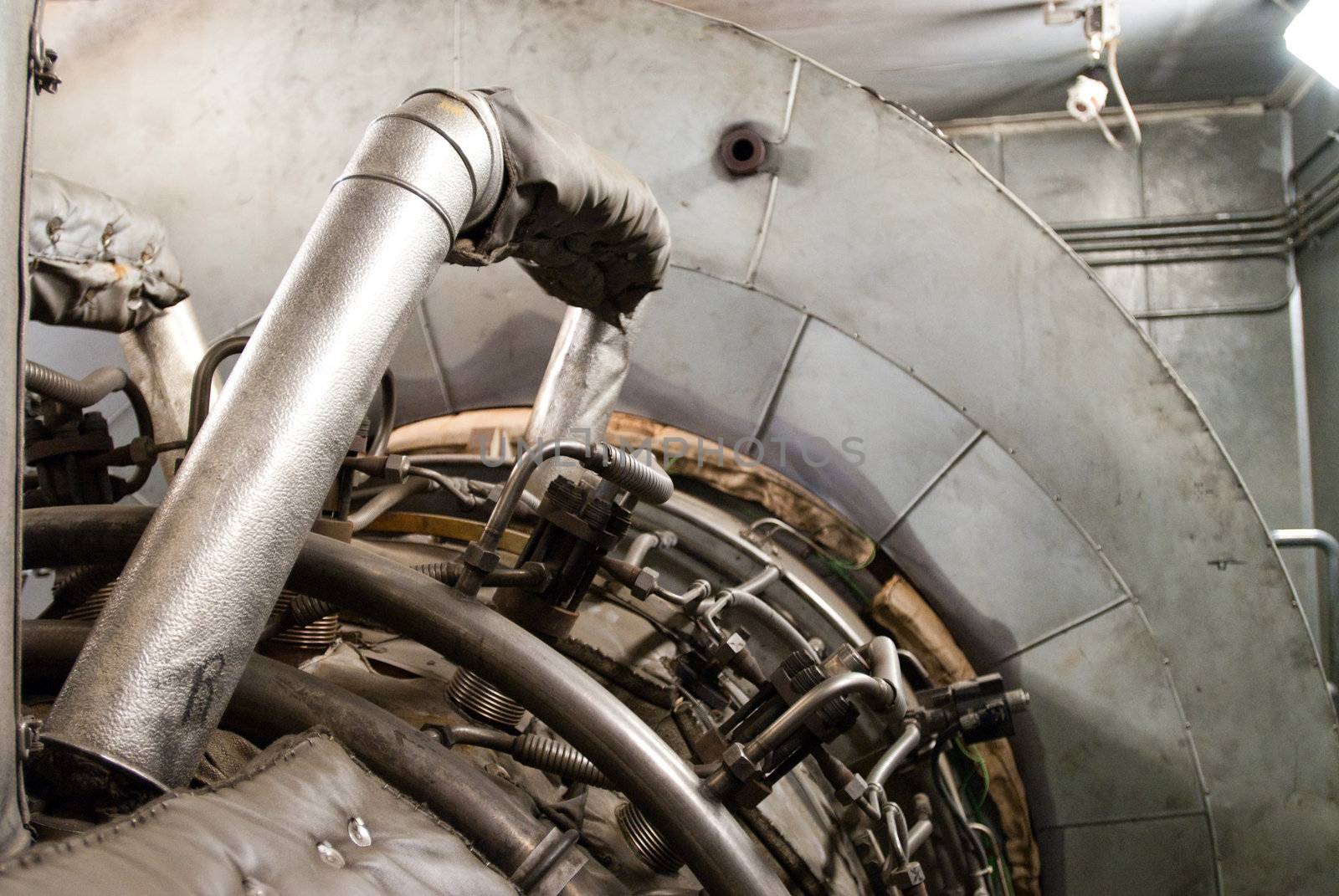 Densely-packed maze of pipes and heavy equipment