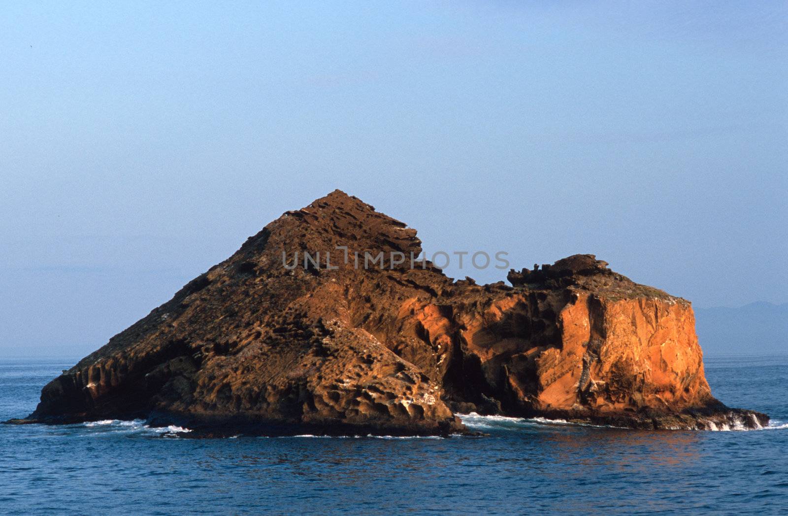 Rocky red island off the Galapagos Islands