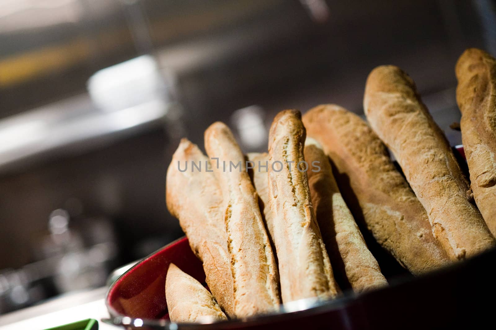 Baguettes in a restaurant kitchen by edan