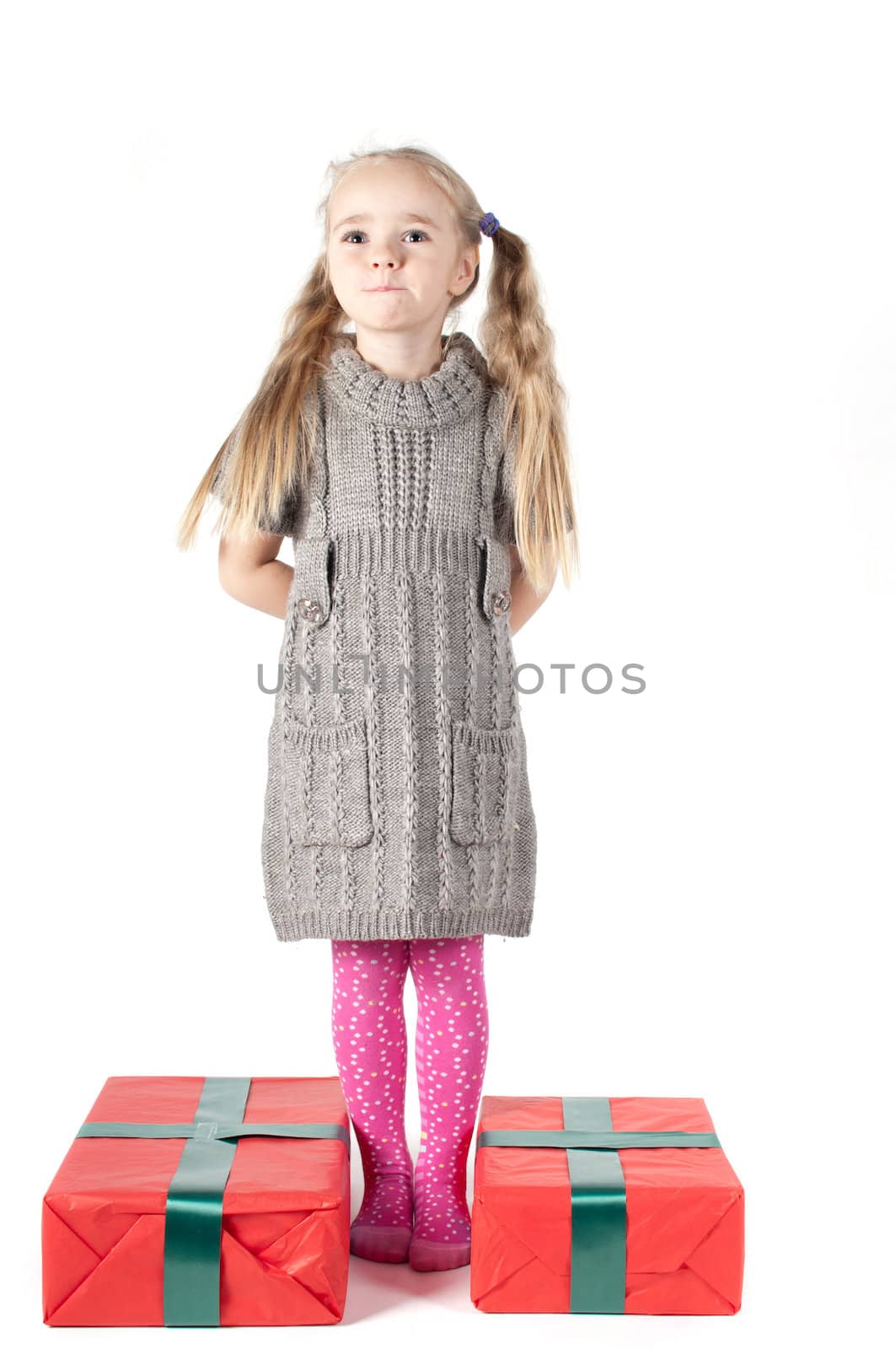 Beautiful girl with two christmas presents on white