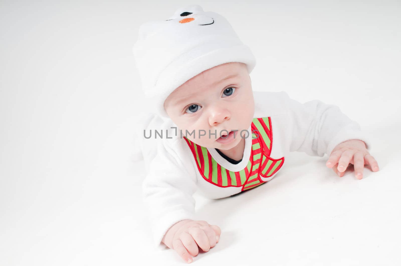 Portrait of baby in snowman costume on light background