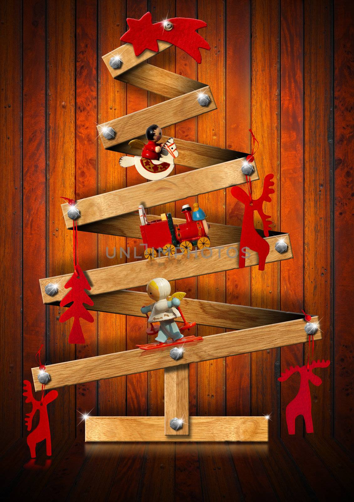 Stylized Christmas tree decorated with Christmas objects on wooden background

