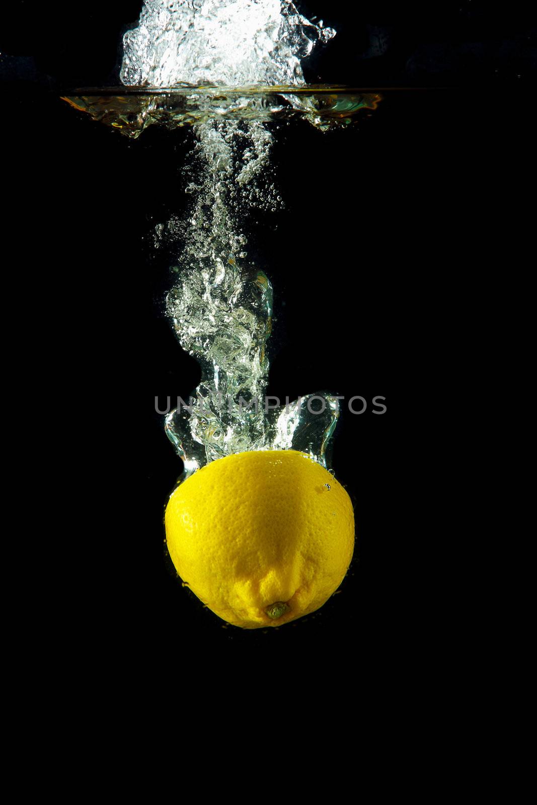 Bright and juicy lemon under water. Fresh and healthy meal