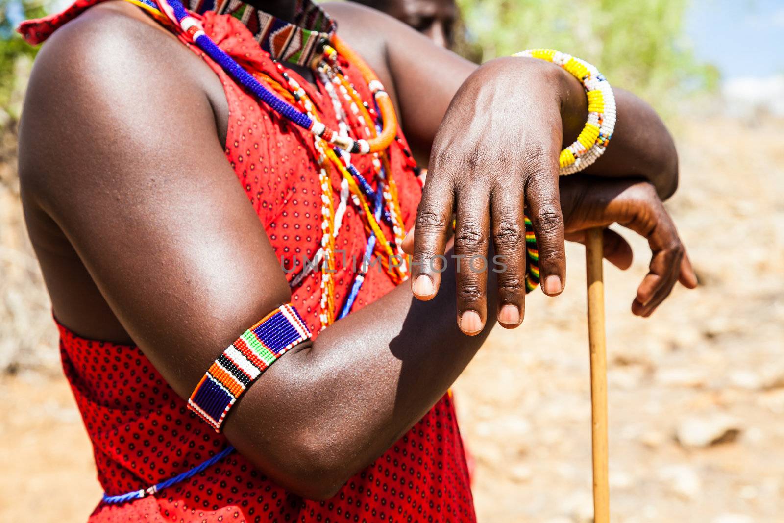 Kenya. Detail of the traditional Masai red costume.