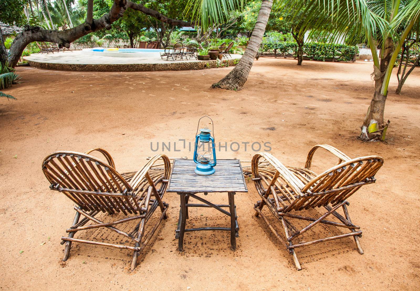 Kenya. Elegant furniture made of wood in an African garden