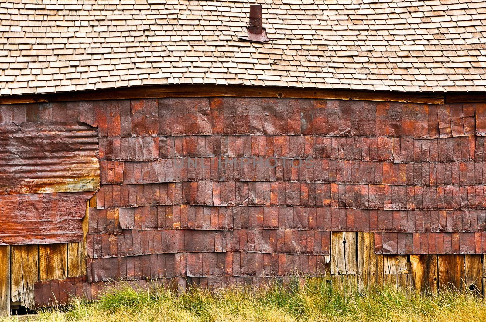 Old wooden barn detail of rusty roof and wall, Bodie village