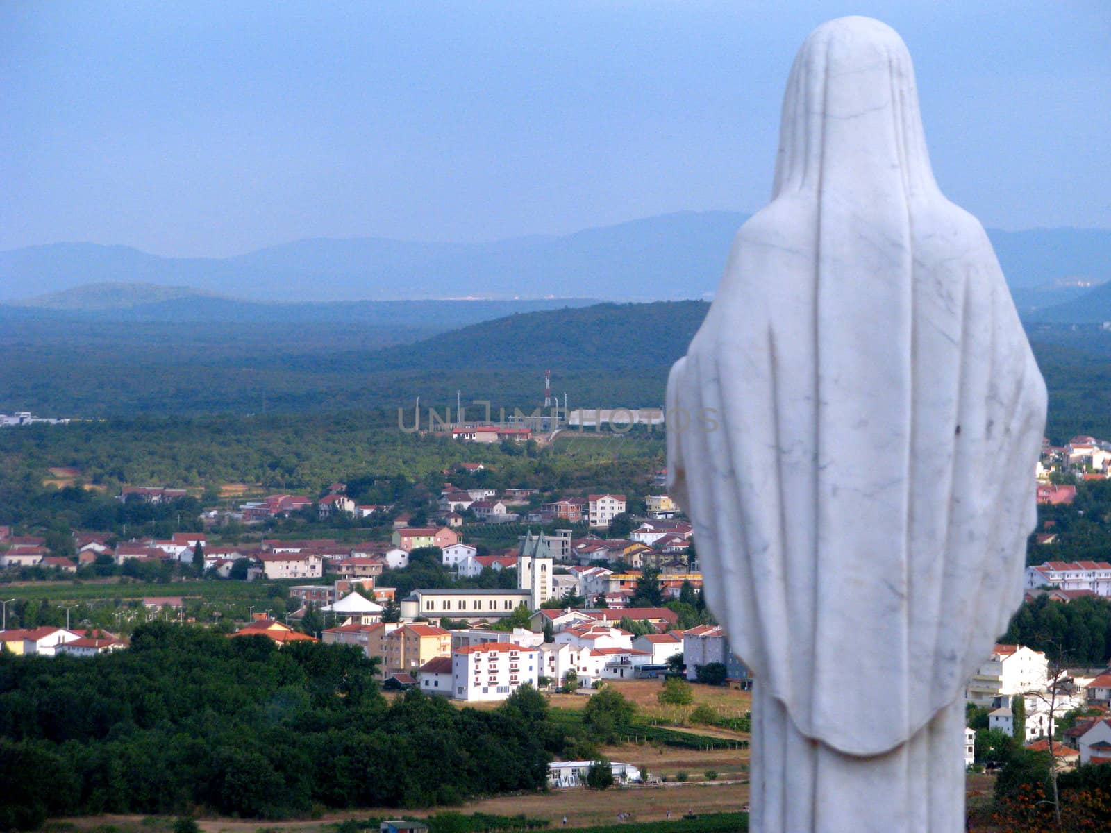 A statue of Our Lady Queen of Peace overlooking the city of Medjugorje, Bosnia - Herzegovina.