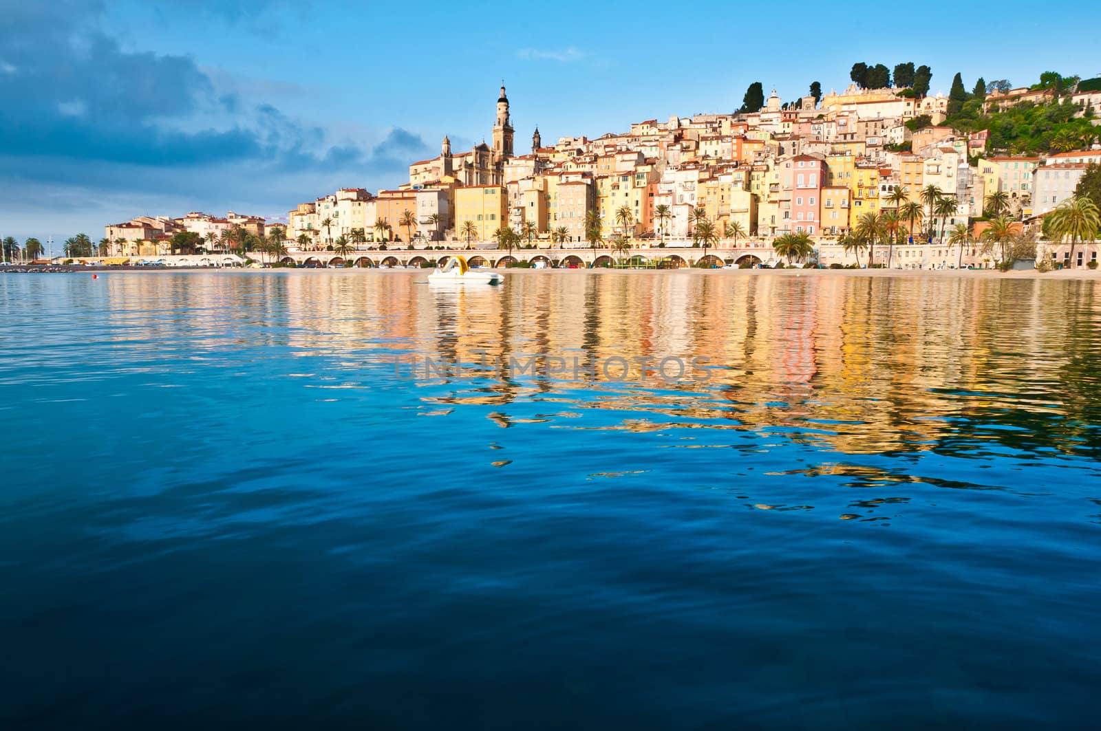 Menton Provence village houses sunrise with water reflections, Menton, France