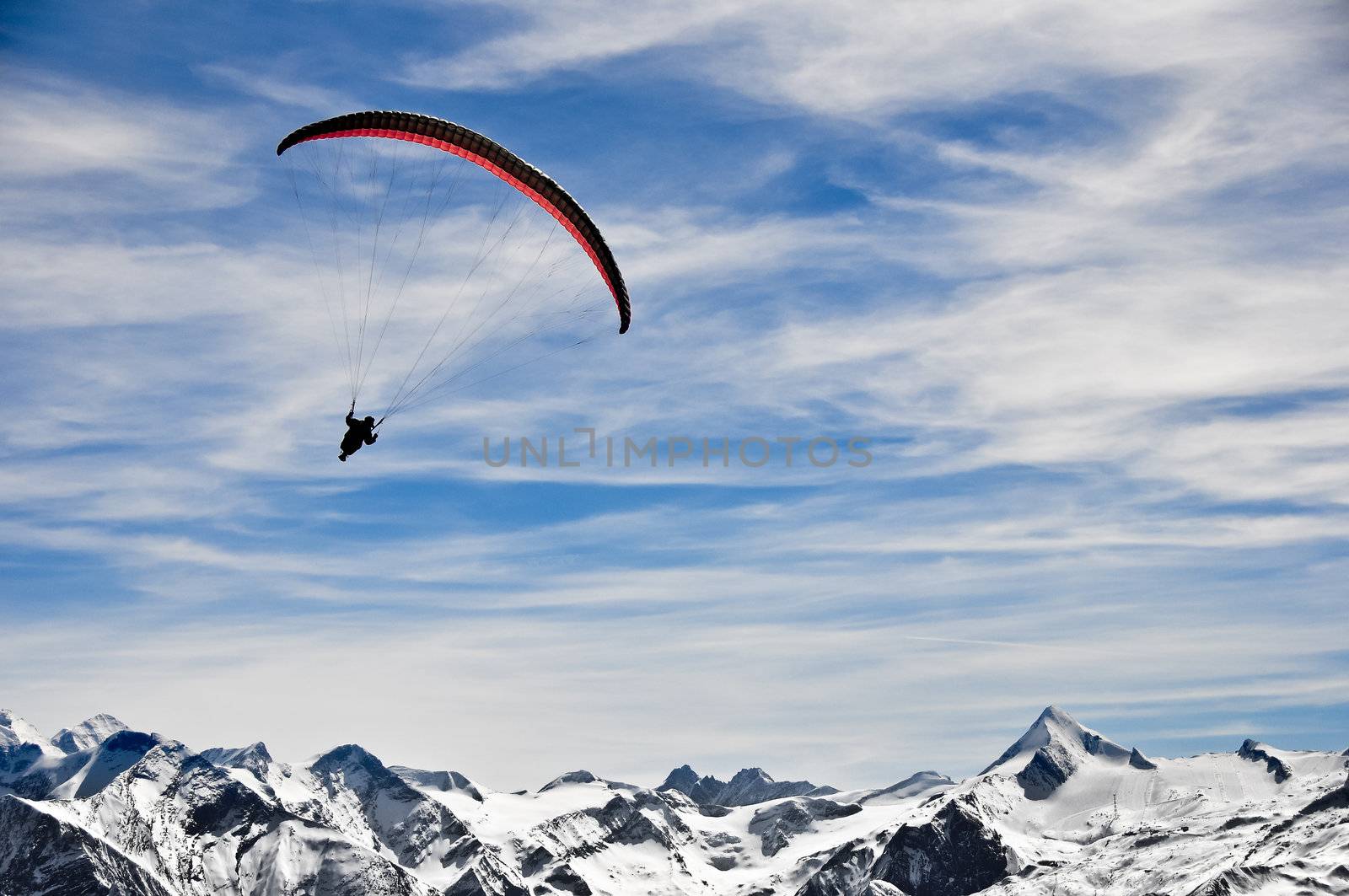 Winter mountains and paragliding with mountains background by martinm303