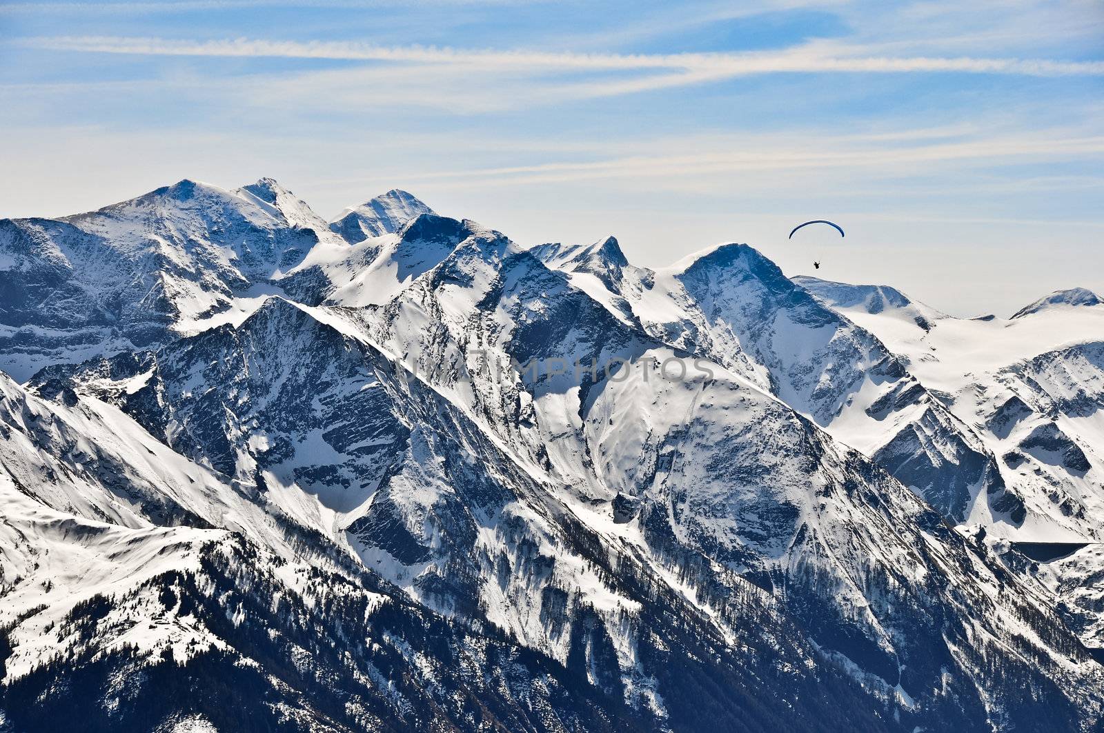 Winter mountains landscape and paragliding, extreme sport