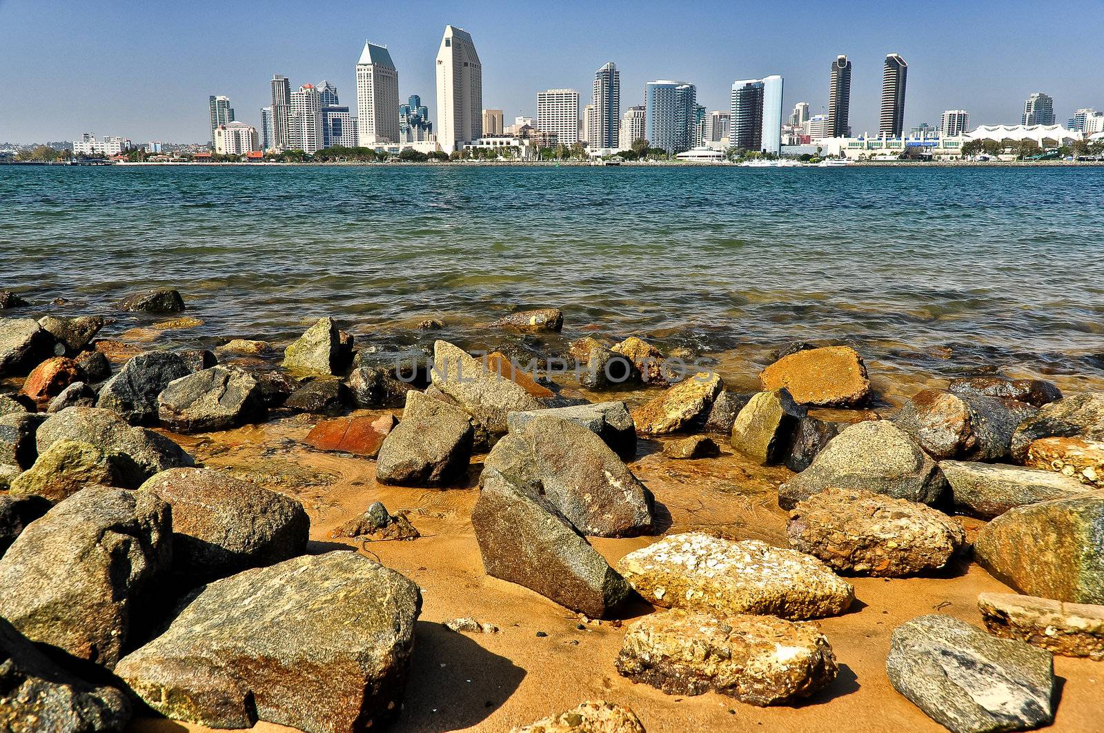 San Diego city view with rocks and water foreground, USA