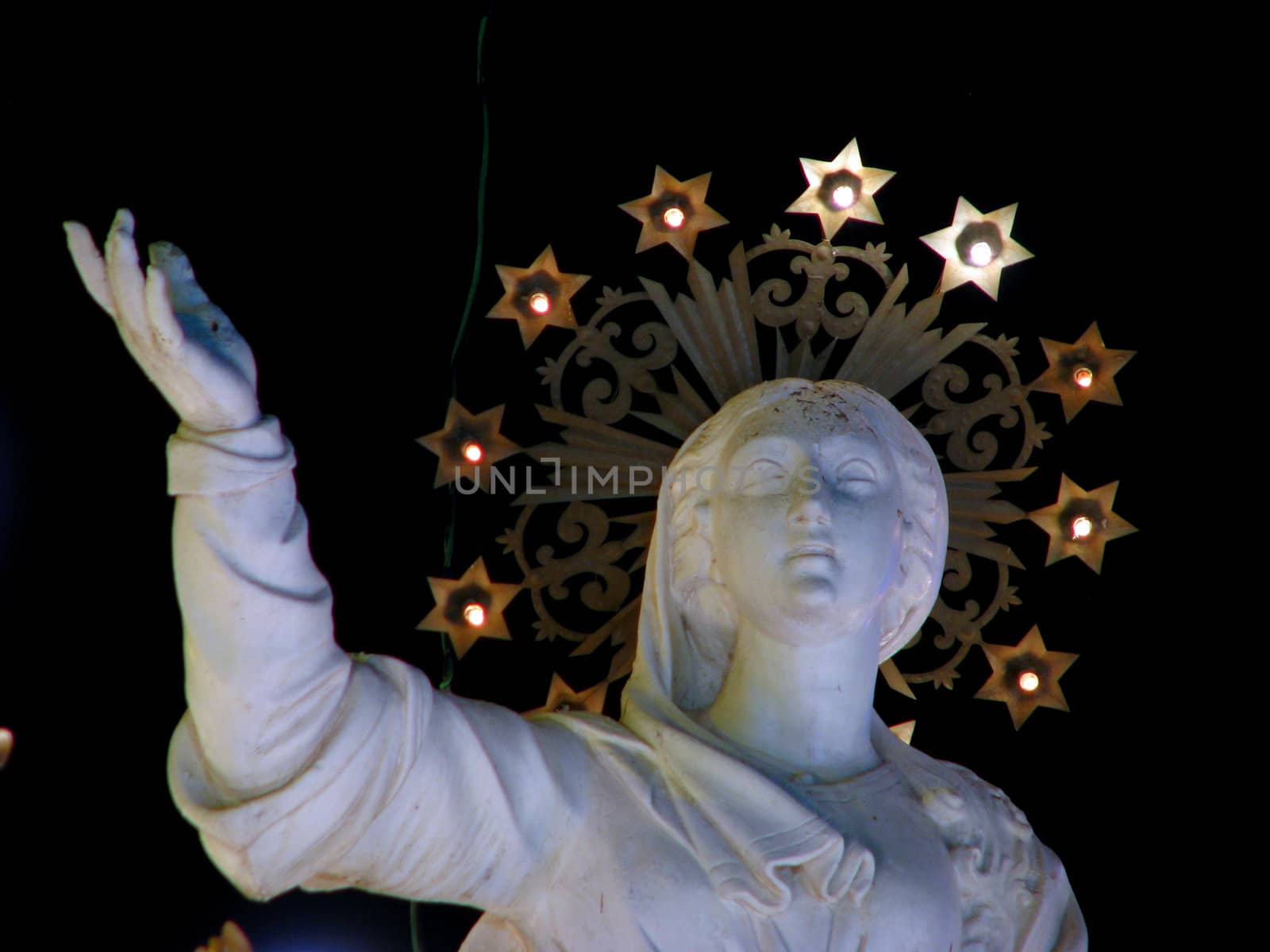 A detail of the stone statue of The Assumption of Our Lady in the church square of Ghaxaq, Malta.