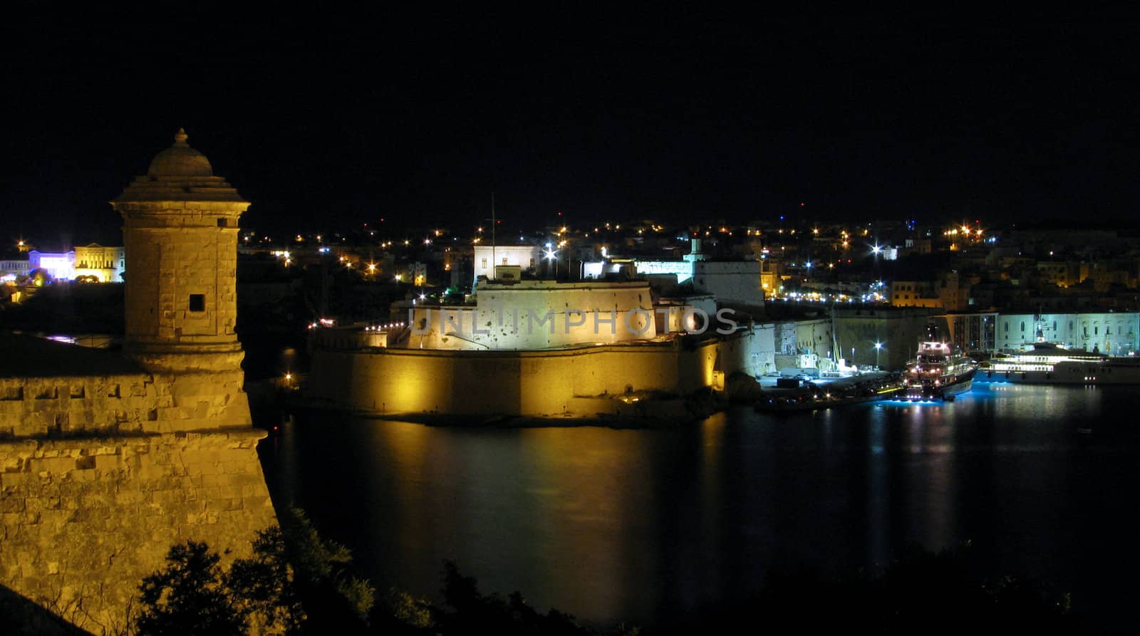 The Grand Harbour by night as seen from Valletta, Malta.