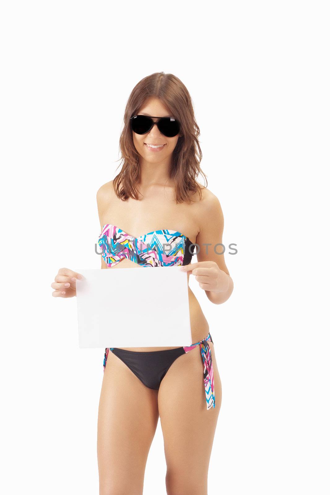 Sexy girl in bikini and sunglasses showing a banner