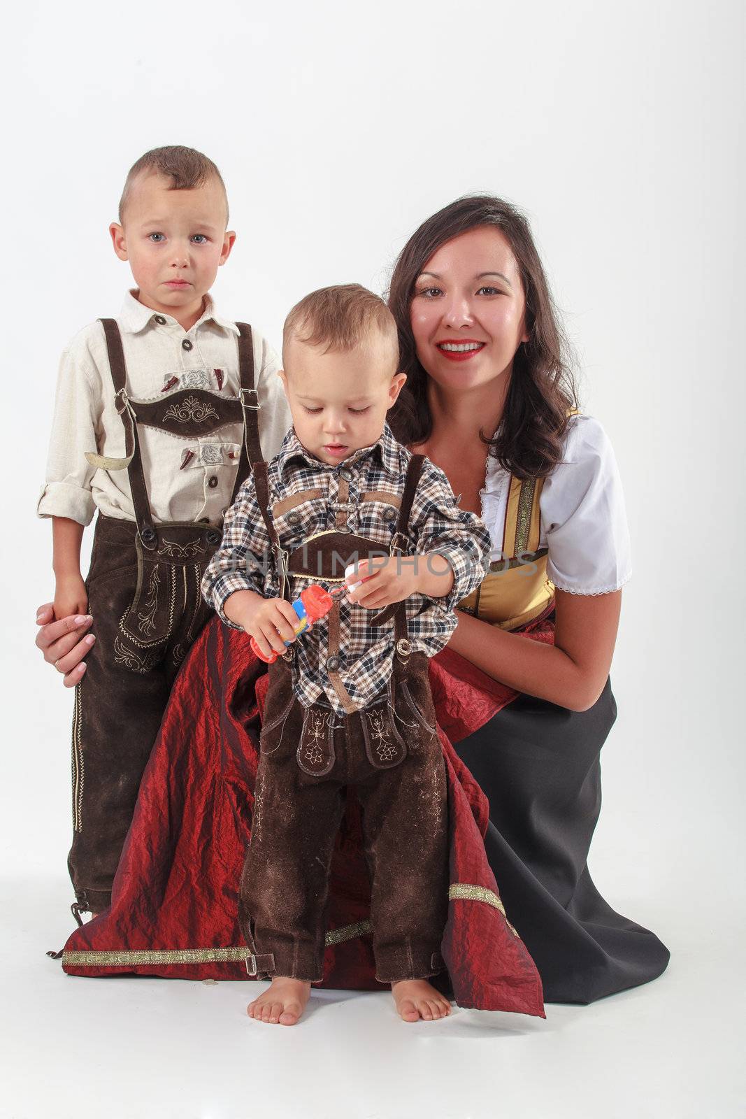 Your mother with two boys in Bavarian costume
