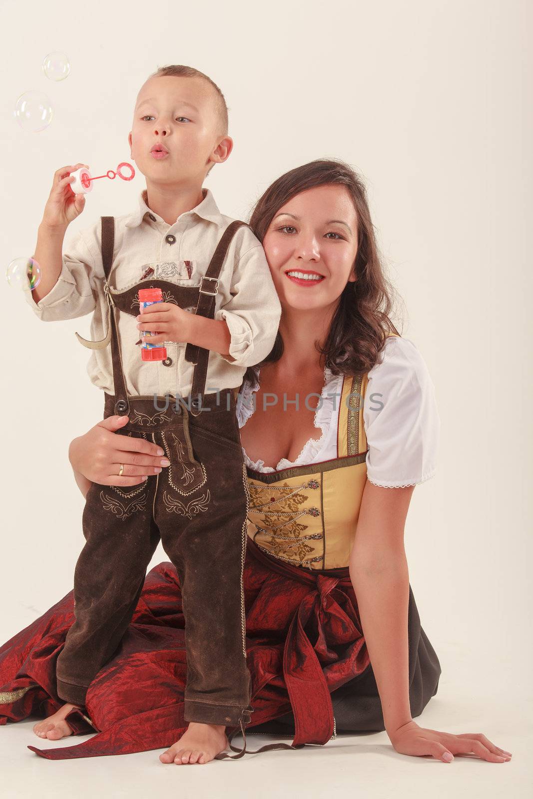 Single mother with her son in Bavarian costume