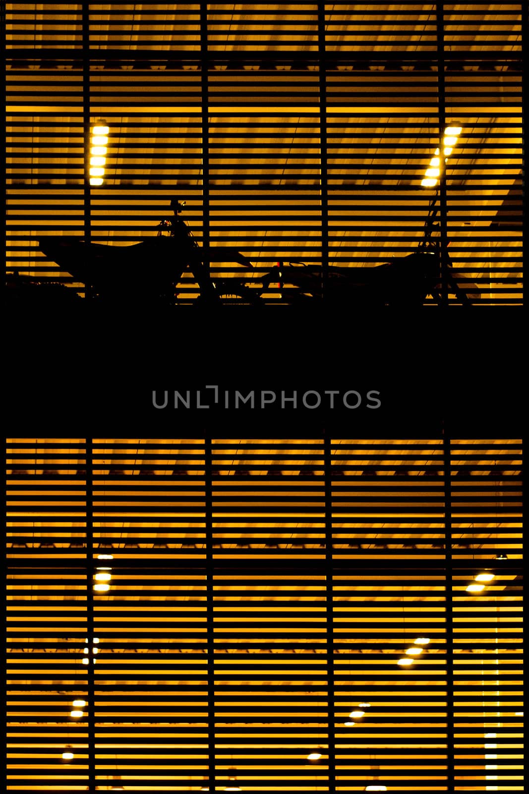 An abstract shot of lights and a dark pattern.