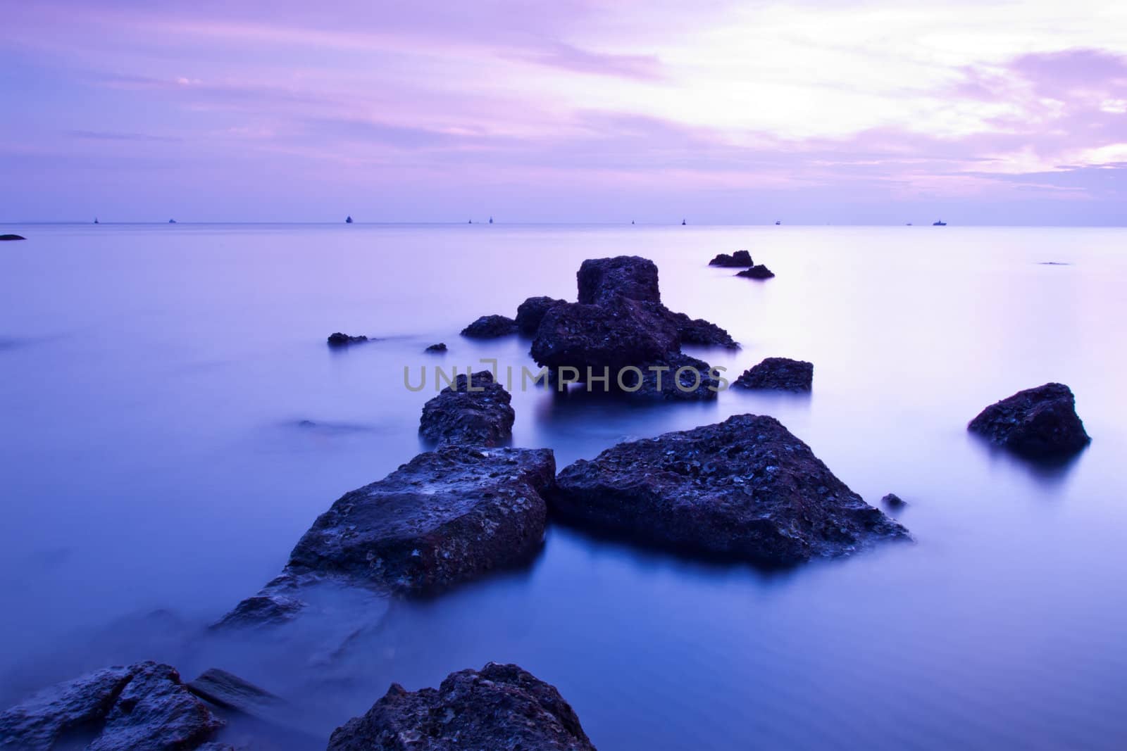 Beautiful seascape. Sea and rock at the sunset