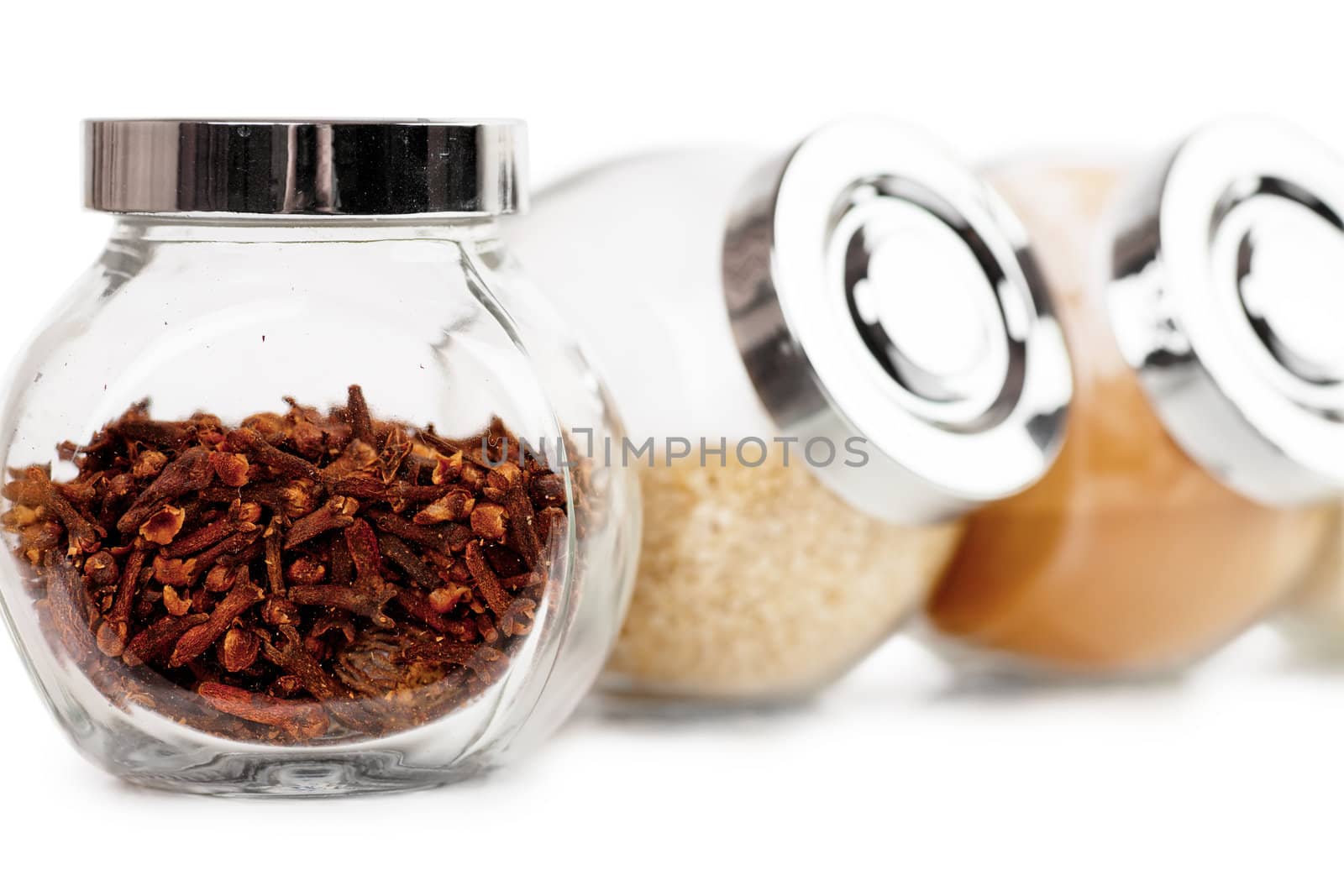 Closeup view of small glass jars with spices