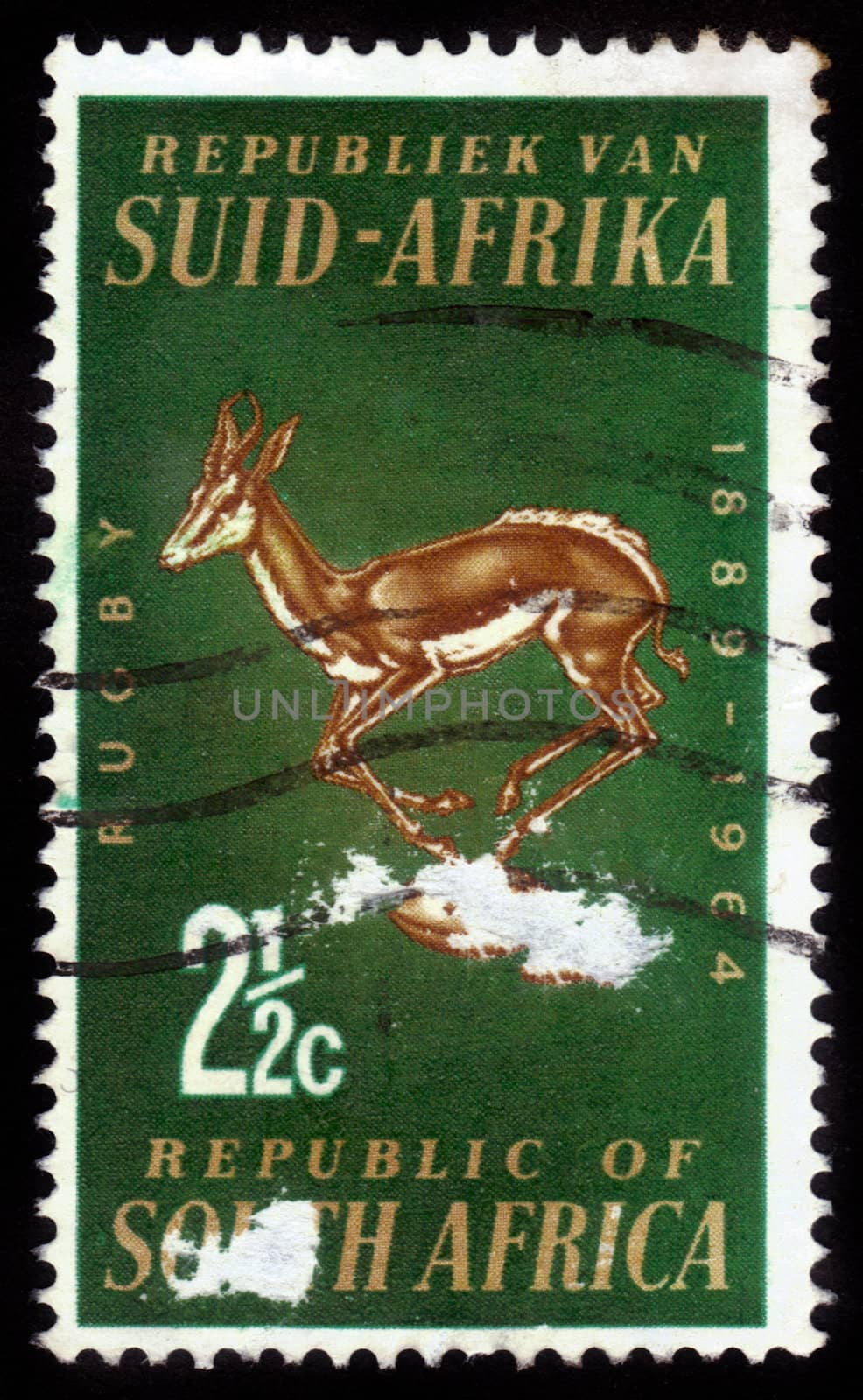 SOUTH AFRICA - CIRCA 1964: A stamp printed in South Africa shows antelope and rugby ball, dedicated to the 75th anniversary of the Rugby Cup, circa 1964