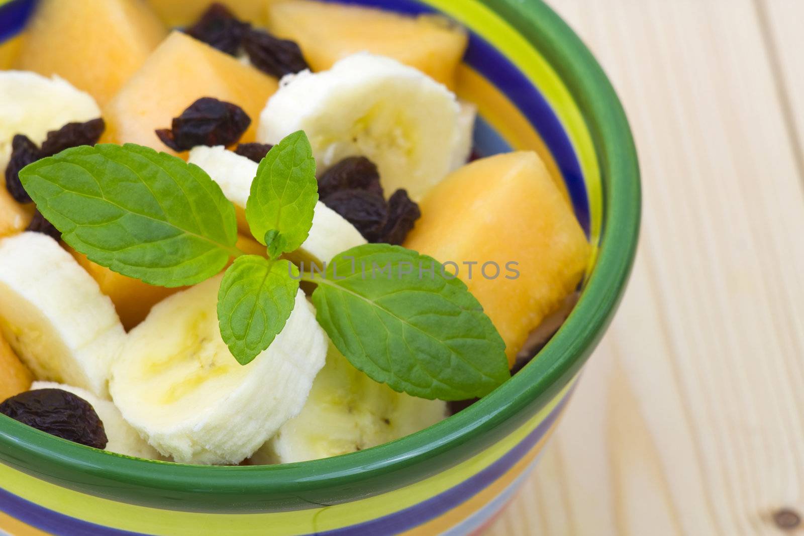 bowl with fresh fruits salad