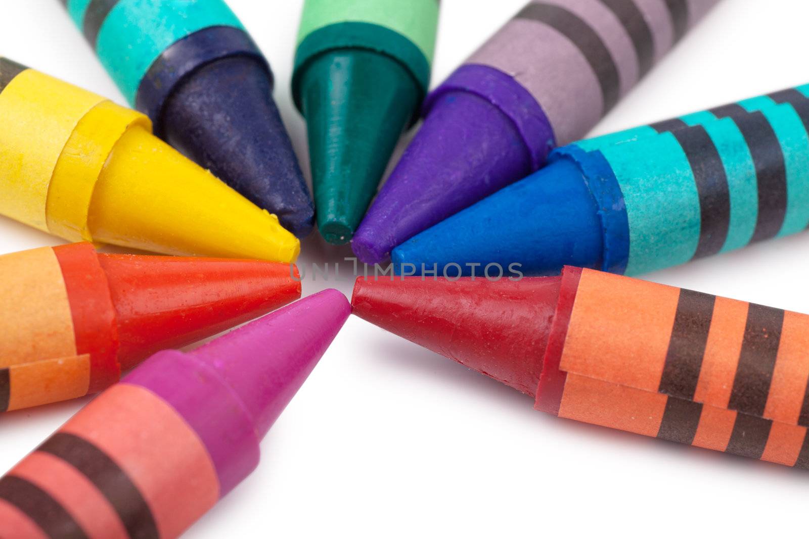 Colorful wax pencils isolated over white background