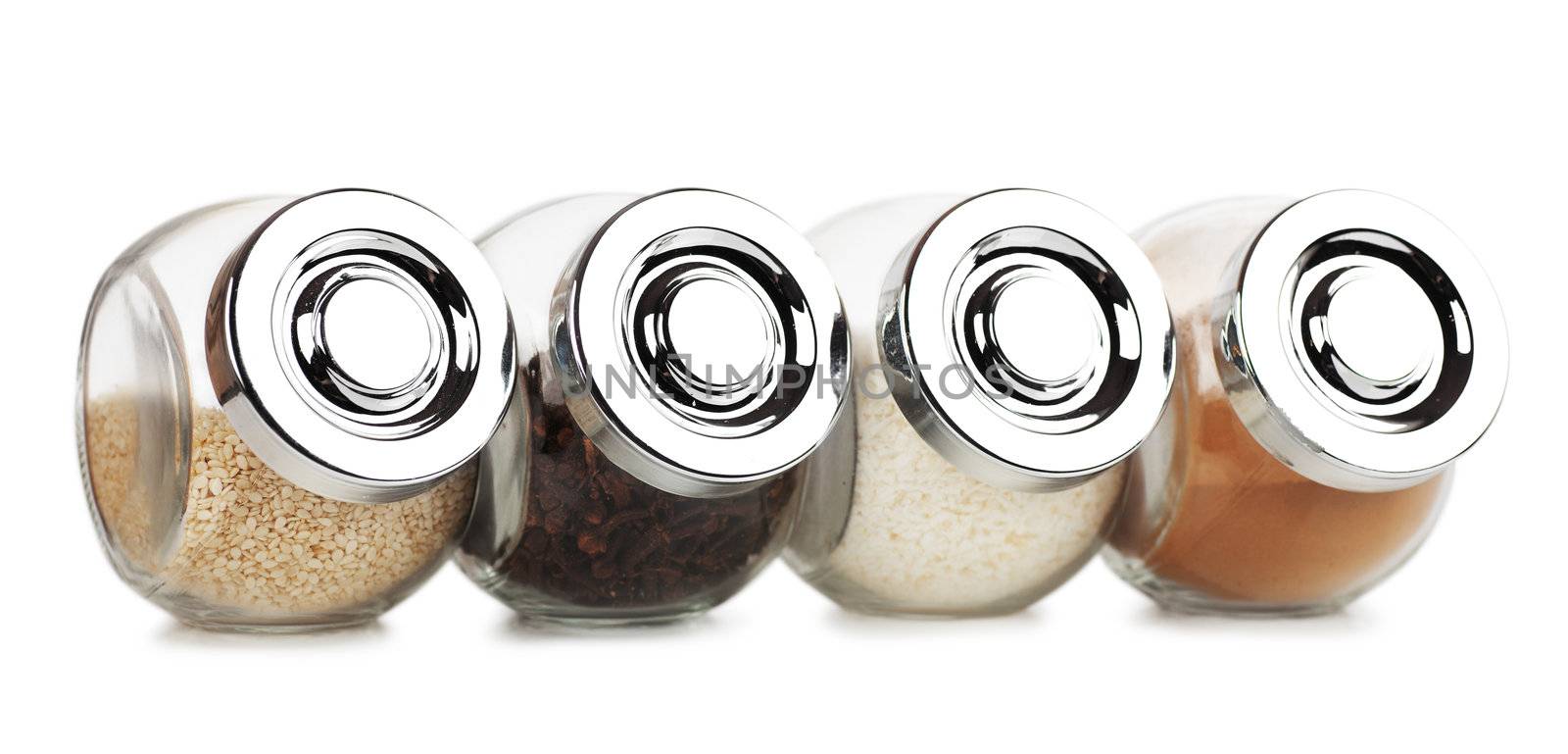 Closeup view of small glass jars with spices