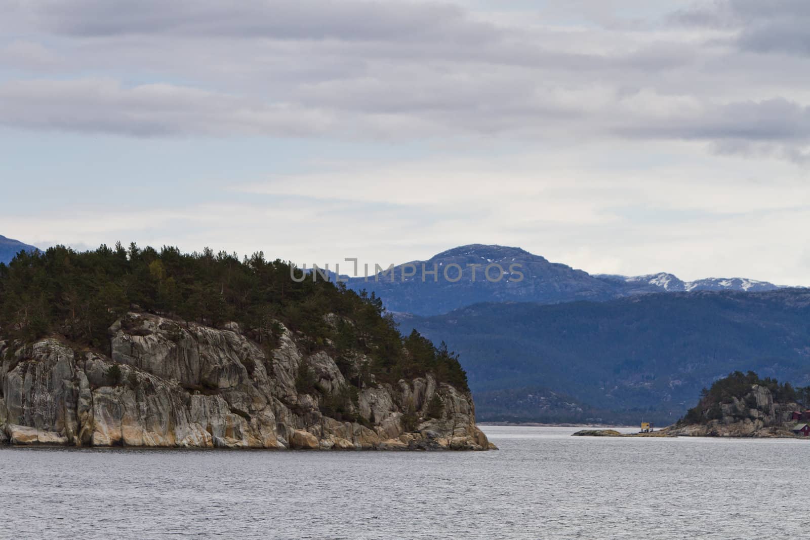 landscape in norway - coastline in fjord with islands