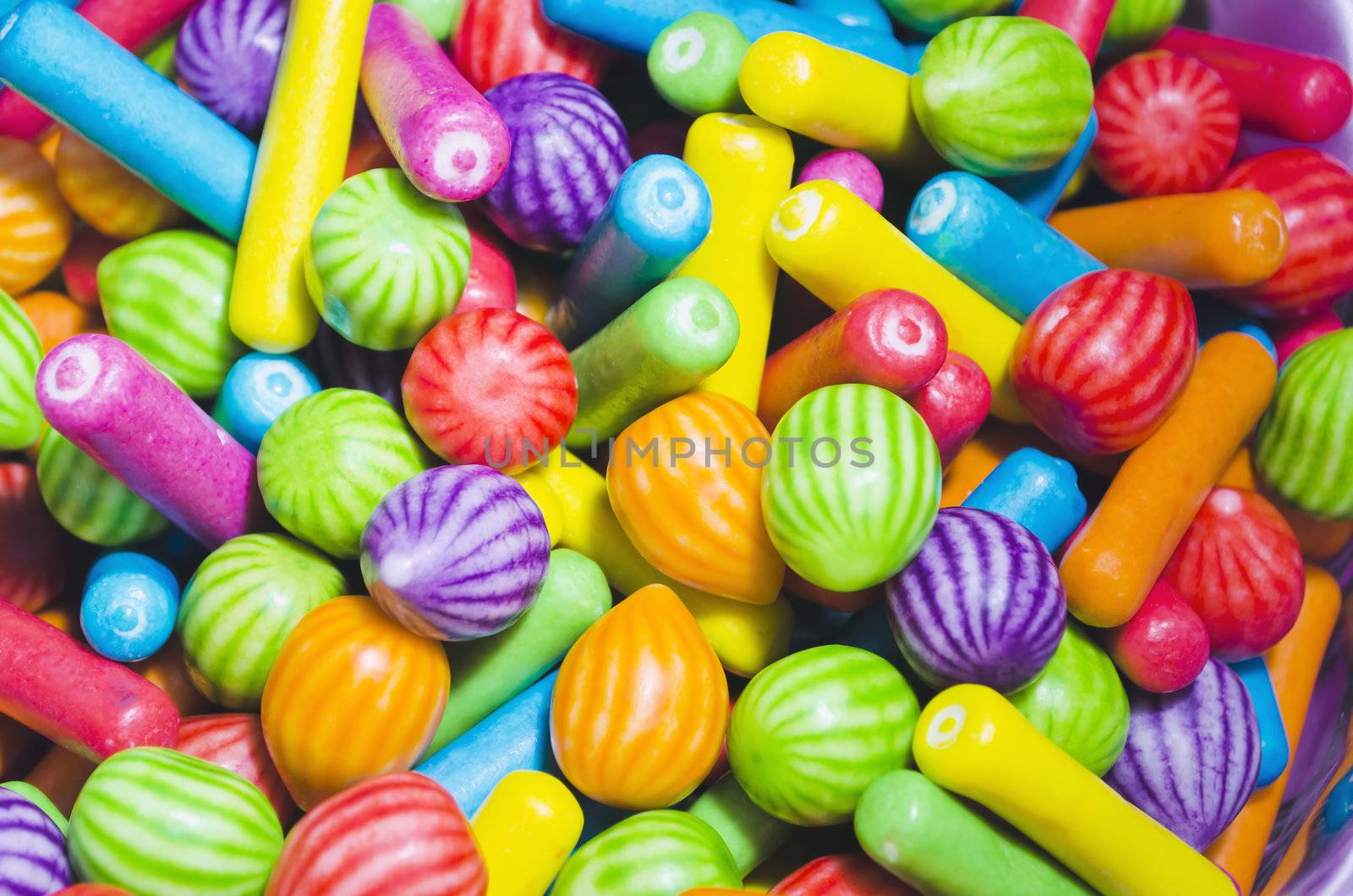 Multi-colored candies that's hard on the outside and soft inside; served in a children's party