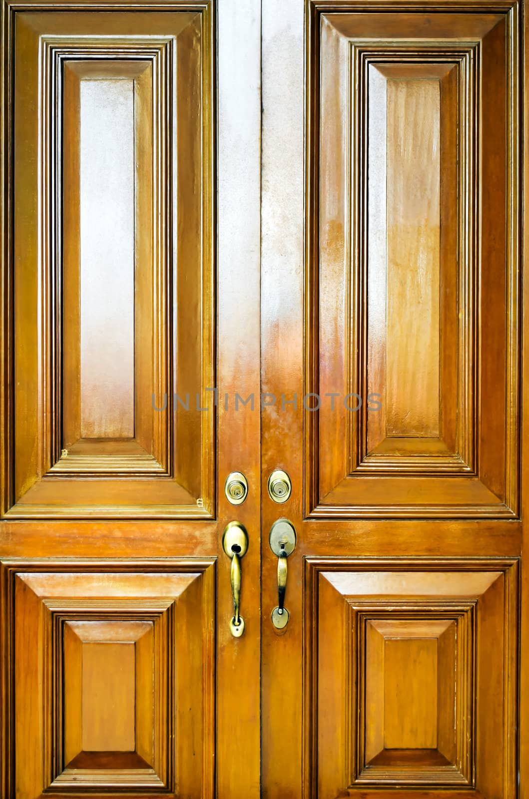 Close-up of heavy wooden door with simple design