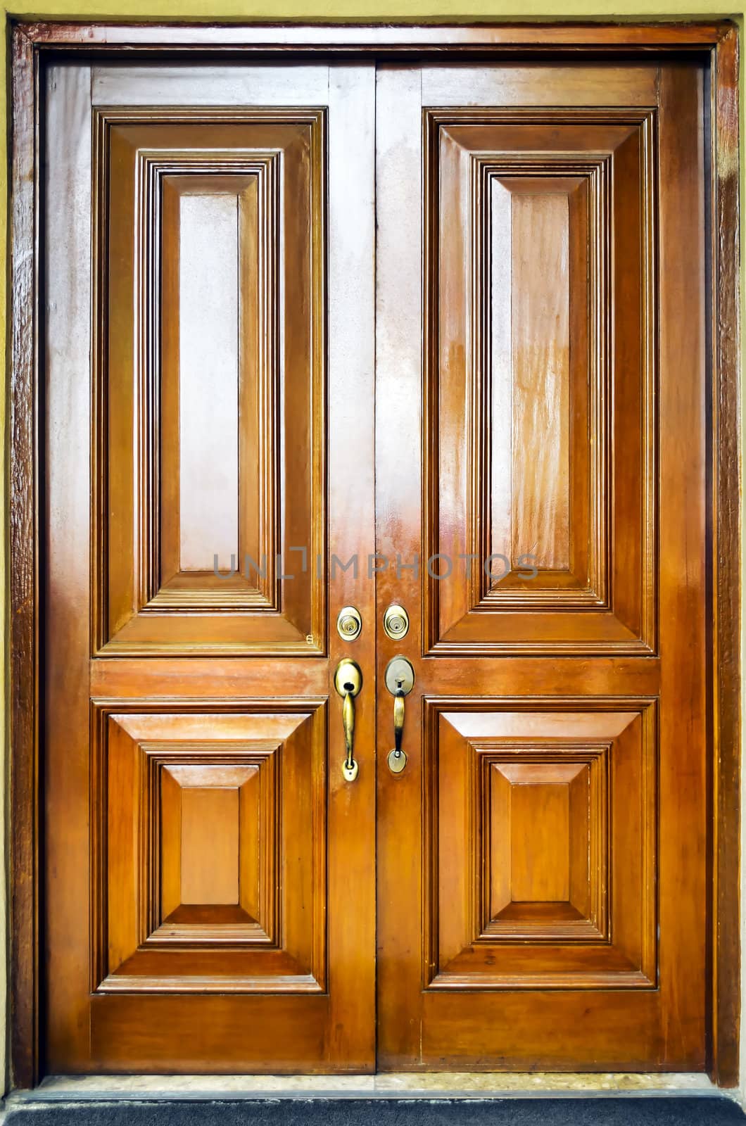 Close-up of heavy wooden door with simple design