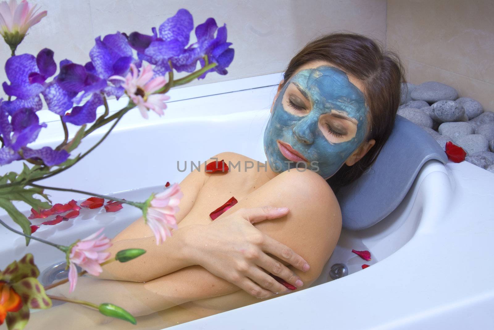 beautiful woman in the bath of spa salon