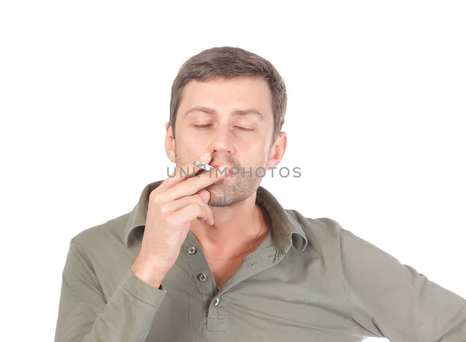 Satisfied man smoking with a blissful expression on his face and his eyes closed as he puffs away on a cigarette isolated on white