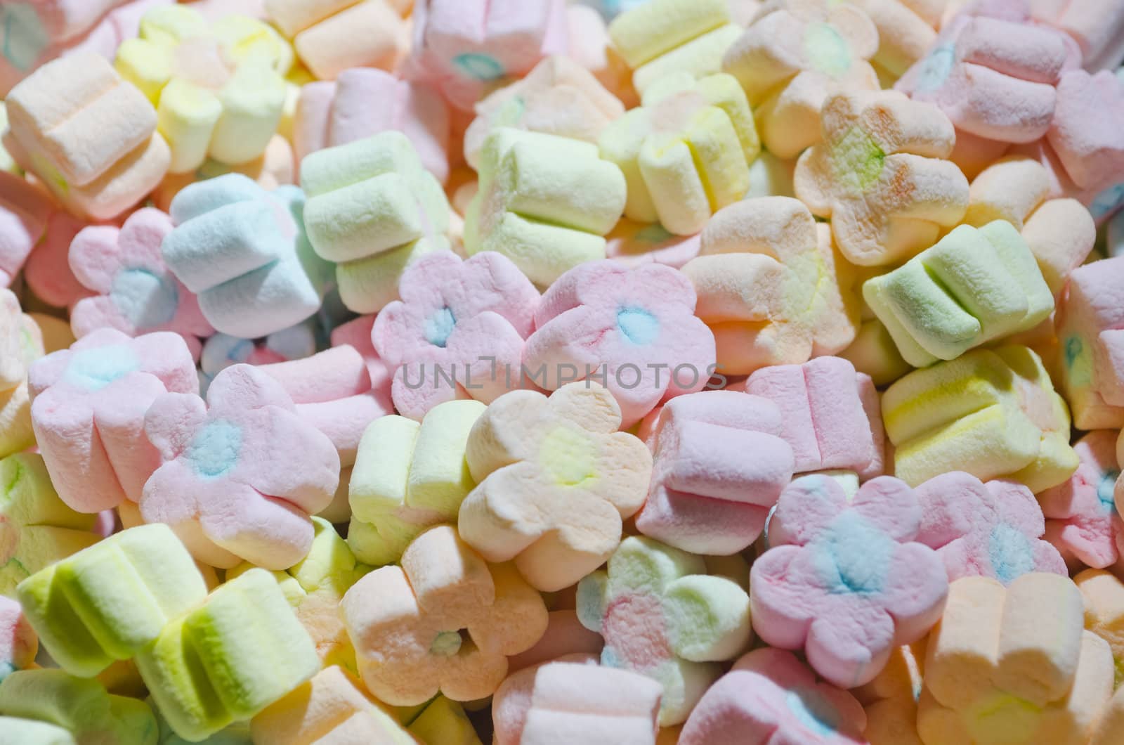 Multicolor flower-shaped marshmallows served at a children's party