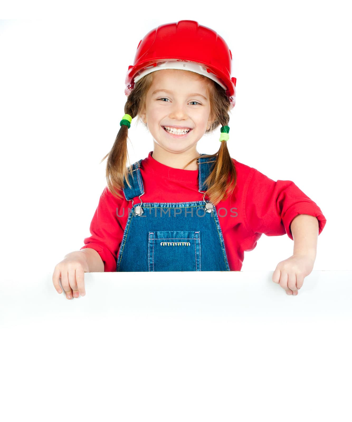 smiling girl in the construction helmet with a white board